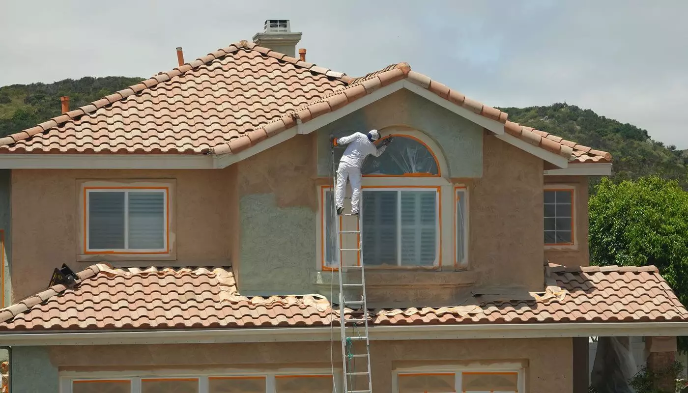 Stucco cracks being repaired